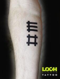 Loch Studio Tattoo - mały tatuaż napis